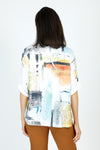 Top Ligne Abstract Artsy Henley in Multi.  Soft multi colored abstract screen print on white.  Mandarin collar split neck textured knit with 2  button placket.  Single breast pocket.  Elbow length roll tab sleeve. Clear sequin trim on collar and pocket.  Relaxed fit._t_59584685965678