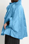 Planet Nylon Chic Cape in Marina. Cocoon shaped double faced nylon jacket with 2 openings for arms. Cross between cape and a poncho._t_59597913588078