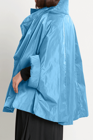 Planet Nylon Chic Cape in Marina. Cocoon shaped double faced nylon jacket with 2 openings for arms. Cross between cape and a poncho._59597913588078