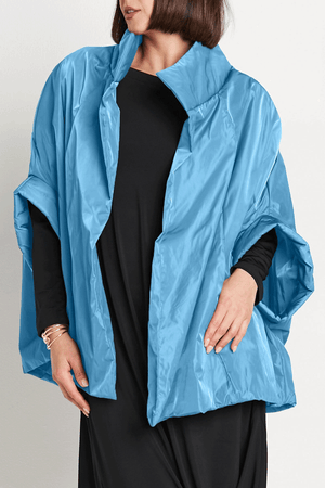 Planet Nylon Chic Cape in Marina. Cocoon shaped double faced nylon jacket with 2 openings for arms. Cross between cape and a poncho._59597913620846