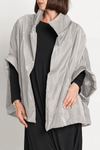 Planet Nylon Chic Cape in Titanium. Cocoon shaped double faced nylon jacket with 2 openings for arms. Cross between cape and a poncho._t_59597913686382