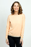 Elliott Lauren Tipping Point Sweater in Peach.  Crew neck color block long sleeve sweater.  Light peach front and dark peach  back with lurex metallic trim at hem and cuff.  Drop shoulder.  Relaxed fit._t_52885911503214