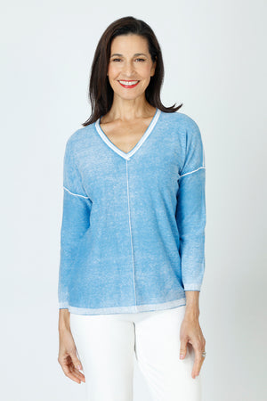 Elliott Lauren Luminosity Sweater in Atlantis blue.  V neck 3/4 sleeve lightweight cotton knit.  Raised center front and back seams in white.  White trim at neck hem and cuff.  Dropped shoulder with raised white seam detail.  Relaxed fit._59626442948974