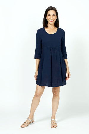 Organic Rags Gauze Dress in Navy. Cotton gauze scoop neck dress with high waist. 3/4 sleeve. 2 front patch pockets._35729930944712