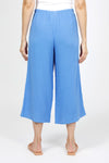 Organic Rags Gauze Pocket Crop in Cornflower blue. Pull on cotton gauze pant with 3/4" contoured flat front waistband, elastic back. Falls straight through the hip, thigh and leg. 2 front pockets. 22" inseam._t_35151267823816