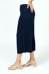 Organic Rags Gauze Pocket Crop in Navy. Pull on cotton gauze pant with 3/4" contoured flat front waistband, elastic back. Falls straight through the hip, thigh and leg. 2 front pockets. 22" inseam._t_35729899782344