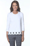 E.L.I. Embroidered Trim Top in White/Black.  Pima/spandex crew neck 3/4 sleeve top with laser cut outs above hem.  Black scroll embroidery at hem.  Scalloped and pointed hem.  Relaxed fit._t_59594653466990