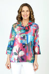 Frederique Abstract Floral Mesh Jacket in Multi.  Bright floral print.  Alternating strips of solid fabric and mesh with a perforated look. Wired convertible collar, button down with 3 oversized black buttons.  3/4 sleeve with tulip pleated cuff. A line shape.  Relaxed fit._t_59651577971054