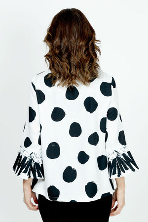 Frederique Dots & Squiggles Jacket in White with black dots and squiggles. Spread collar with adjustable wire. 3/4 sleeve with tulip hem. 4 novelty button clowure. Squiggle print on inner collar, button placket and sleeve cuff. Relaxed fit._35989252669640