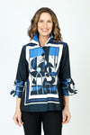 Frederique Abstract Art Frame Jacket in Black/Blue.  Framed abstract print in front and back in royal, black and white.  Black background.  Lightly textured button front jacket with adjustable wire collar.  3/4 sleeve with printed tulip hem.  A line shape.  Relaxed fit._t_59687991673198