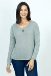 Organic Rags Star Sweater in Olive.  Textured v neck with metallic thread and single sequin star in front.  Long sleeves.  Dropped shoulders.  Rib trim at hem and cuff.  Relaxed fit._t_52915069845870