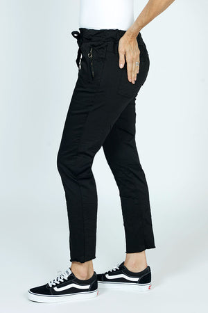 Organic Rags Raw Hem Pull On Pant in Black.  Drawstring waist pant.  2 front zip pockets with silver zipper trim.  Slim leg.  Raw hem.  Inseam: 27 1/2"_52912168501614