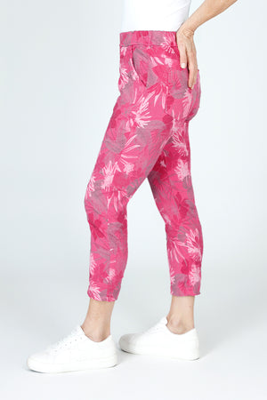 Organic Rags Layered Leaves Print Crop in Hot Pink.  Large layered leaves in gray and white on a pink background.  Elastic waist pull on pant with 2 front slash pockets and 2 rear patch pockets.  Lightly crinkled fabric.  24" inseam.  _59675061715310