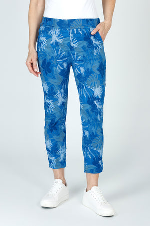 Organic Rags Layered Leaves Print Crop in Royal.  Large layered leaves in navy and white on a royal blue  background.  Elastic waist pull on pant with 2 front slash pockets and 2 rear patch pockets.  Lightly crinkled fabric.  24" inseam.  _59675061551470