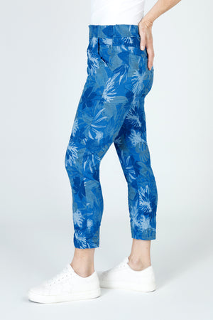 Organic Rags Layered Leaves Print Crop in Royal.  Large layered leaves in navy and white on a royal blue  background.  Elastic waist pull on pant with 2 front slash pockets and 2 rear patch pockets.  Lightly crinkled fabric.  24" inseam.  _59675061649774