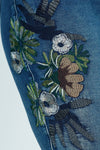 Organic Rags Embroidered  Ankle Jean in Denim.  Medium wash pull on jean with elastic waist.  Floral embroidery on side of right leg.  2 front slash pockets; 2 rear patch pockets.  27 1/2" inseam._t_52915082330478