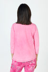 Organic Rags Ruffle Henley in Hot Pink.  Crew neck with split placket. Ruffle trim on 1 side of placket.  3/4 sleeve.  Curved hem.  Relaxed fit._t_59648072941934