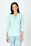 Organic Rags Ruffle Henley in Tiffany, an aqua shade.  Crew neck with split placket. Ruffle trim on 1 side of placket.  3/4 sleeve.  Curved hem.  Relaxed fit._t_59648072843630