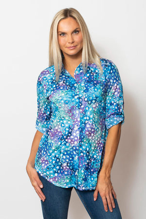 Sno Skins Bubbles Printed Crinkle Blouse.  Blue, purple and aqua bubble print.  Pointed collar button down with 3/4 sleeve with roll button tab.  Shirttail hem.  Relaxed fit._59765462827374