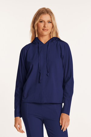 Mododoc Kimono Sleeve Hoodie in Vibrant Navy.  French terry sweatshirt pullover.  Crew neck with attached drawstring hood.  Long dolman sleeves. Front and back center seam detail.  Slightly curved hem.  Rolled edges. Relaxed fit._59622549356910