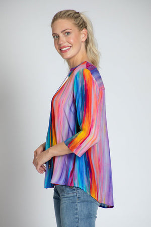 APNY Rainbow Tassel Top in Multi. Vertical watercolor stripes in rainbow colors. Banded crew neck with split v placket. String tie with tasseled ends. 3/4 sleeve. Curved hem. Relaxed fit._35754150101192