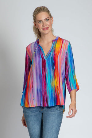 APNY Rainbow Tassel Top in Multi.  Vertical watercolor stripes in rainbow colors.  Banded crew neck with split v placket.  String tie with tasseled ends.  3/4 sleeve.  Curved hem. Relaxed fit._35754150068424