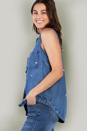 Billy T Scarlet Sleeveless Shirt in Denim. Medium blue pointed collar button down sleeveless shirt with embroidered stars in white. 2 front patch pockets. Inserts at side seams. Banded high low shirt tail hem. Back placket with inverted pleat. Relaxed fit._35798307733704