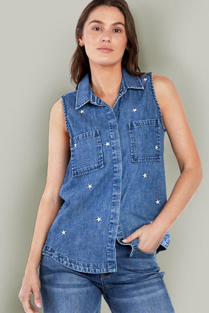 Billy T Scarlet Sleeveless Shirt in Denim.  Medium blue pointed collar button down sleeveless shirt with embroidered stars in white.  2 front patch pockets.  Inserts at side seams.  Banded high low shirt tail hem.  Back placket with inverted pleat.  Relaxed fit._35798307700936