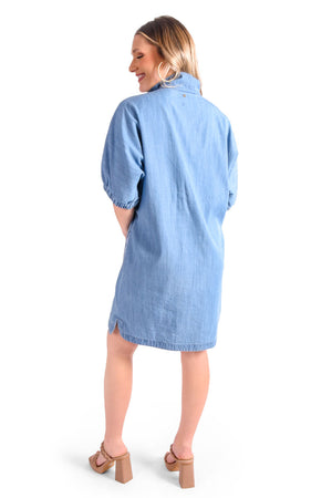 Emily McCarthy Denim Chambray Poppy Dress in Light Denim. Convertible collar split neck dress. Dolman elbow length sleeve with elastic cuff. Side seam pockets. Side slits. Relaxed fit._35611072594120