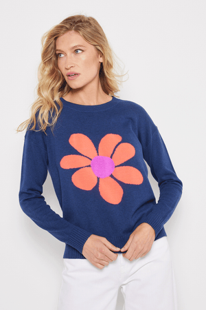 Lisa Todd Sweet Talk Sweater in Blue Galaxy.  Dark blue cotton knit with large center front flower.  Orange petals and bright pink textured center disc.  Long sleeves. Dropped shoulder.  Rib trim at neck, hem and cuff.  Relaxed fit._59667041354094