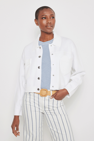 Lisa Todd Beat Goes On Jacket in white.  Pointed collar snap front jacket with long sleeves.  Cropped jacket with banded hem and belt loops.  Right breast snap flap pocket.  Left breast heart pocket.  Boxy shape. _59670938616174