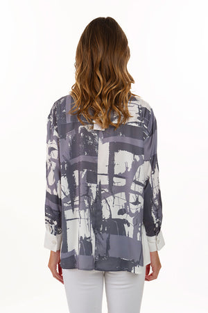 Lemon Grass Gray Handprint Blouse. Gray abstract geometric screen print on a white background. Pointed collar button down blouse with wrapped side seams from back to front. Curved front hem; straight back hem. Bracelet length sleeves with button cuff. Back yoke.  Relaxed fit._35740049604808