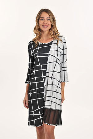 Lemon Grass Mesh Detail Reversible Round Neck Dress in Black.  Black and white geometric print reverses to different black and white print with black mesh inset.  Round neck 3/4 sleeve reversible a-line dress.  Diagonal seaming in front.  Mesh inset on 1 side of front.  A line shape.  Relaxed fit._59706628276590