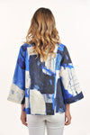 Lemon Grass Flare Jacket in Granada Blue.  Mixed abstract shapes and scribble print in shades of blue on a cream background.  Pointed collar 2 button closure.  3/4 wide sleeve
2 back vents.  Side seam pockets with button detail.  Swing a-line shape.  Relaxed fit._t_59764688322926