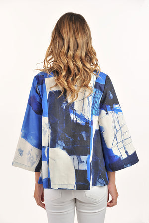 Lemon Grass Flare Jacket in Granada Blue.  Mixed abstract shapes and scribble print in shades of blue on a cream background.  Pointed collar 2 button closure.  3/4 wide sleeve
2 back vents.  Side seam pockets with button detail.  Swing a-line shape.  Relaxed fit._59764688322926