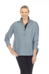 Terra Chic Woven Top in Winter Sky.  Convertible stand collar split neck popover with 2 button placket.  Color block insert on inner placket.  Long sleeves with button cuffs reverse to contrast color.  In seam pouch pockets.  High low hem.  Side slits.  Relaxed fit._t_59403081515374