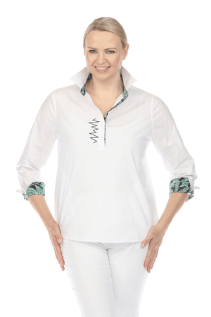 Terra Contrast Collar & Cuff Top.  White popover with navy embroidery and contrast print inner cuff, underside of collar and inner placket.  Pointed collar with 5 button placket.  3/4 sleeve with split turn-back cuff.  Shirt tail high low hem.  Relaxed fit._59698204082542