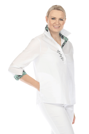 Terra Contrast Collar & Cuff Top.  White popover with navy embroidery and contrast print inner cuff, underside of collar and inner placket.  Pointed collar with 5 button placket.  3/4 sleeve with split turn-back cuff.  Shirt tail high low hem.  Relaxed fit._59698204180846