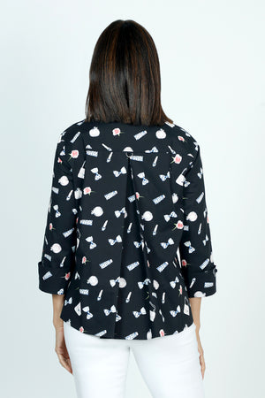 Cali Girls Betty Perfume Print Blouse in Black.  Perfume bottles print in white and pink on a black background.  Pointed collar button down blouse with hidden button placket.  Pink zipper detail above left breast.  3/4 sleeve with fold back cuff.  Back yoke with inverted back pleat.  A line shape.  Relaxed fit._59491586113902