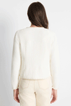 NIC+ZOE Stitch Trim Knit Jacket in Classic Cream.  Crew neck long sleeve textured knit jacket with hook and eye closures at the front.  Long sleeves. Front pockets at the chest with metallic button trim.  Embroidered ribbon trim at edges.  Rear contour darts.  Fitted.  _t_59575199105390