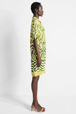 NIC+ZOE Aloe Palms Devon Dress in Green Multi.  Batik-inspired mixed prints with border.  Pointed collar split neck dress with dolman short sleeve.  Front welt pockets.  Side slits.  Relaxed fit._59575260414318