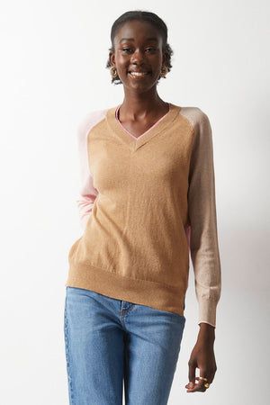 Zaket & Plover College Sweater in Cookie.  Colorblock v neck sweater.  Camel front, pink back.  2 long raglan sleeves, colorblocked from front to back.  Light pink sleeve on right front with cocoa back.  Beige sleeve on left with rust back. Rib trim at neck, hem and cuff.  Contrast color tipping at cuff.  Relaxed fit._52914797740398