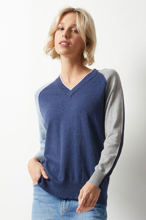 Zaket & Plover College Sweater in Denim.  Colorblock v neck sweater.  Denim front,  heather gray back.  2 long raglan sleeves, colorblocked from front to back.  Light blue sleeve on right front with lime back.  Heather gray sleeve on left with navy back. Rib trim at neck, hem and cuff.  Contrast color tipping at cuff.  Relaxed fit._52914797937006