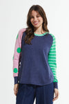 Zaket & Plover Spots & Stripes Sweater in Denim.  Crew neck sweater with modified raglan sleeves.  Color blocking on sleeves.  1 sleeve has contrast intarsia dots - the other contrast stripes.  Curved hem. Contrast color rib at neck.  Rib trim at hem and cuff.  High low hem.  Relaxed fit._t_59867403125102