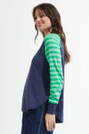 Zaket & Plover Spots & Stripes Sweater in Denim.  Crew neck sweater with modified raglan sleeves.  Color blocking on sleeves.  1 sleeve has contrast intarsia dots - the other contrast stripes.  Curved hem. Contrast color rib at neck.  Rib trim at hem and cuff.  High low hem.  Relaxed fit._t_59867403223406