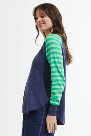 Zaket & Plover Spots & Stripes Sweater in Denim.  Crew neck sweater with modified raglan sleeves.  Color blocking on sleeves.  1 sleeve has contrast intarsia dots - the other contrast stripes.  Curved hem. Contrast color rib at neck.  Rib trim at hem and cuff.  High low hem.  Relaxed fit._59867403223406