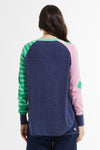 Zaket & Plover Spots & Stripes Sweater in Denim.  Crew neck sweater with modified raglan sleeves.  Color blocking on sleeves.  1 sleeve has contrast intarsia dots - the other contrast stripes.  Curved hem. Contrast color rib at neck.  Rib trim at hem and cuff.  High low hem.  Relaxed fit._t_59867403190638