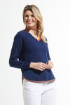 Zaket & Plover Round Bottom V Neck Sweater in Navy.  V neck raglan long sleeve sweater.  Rainbow stripe inset at neckline.  Curved hem with narrow stripe trim.  Contrast color hand stitching on right armhole.  Rib trim at neck and cuff. Rainbow stripe tipping on sleeves. Relaxed fit._t_59493869453678