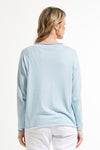 Zaket & Plover Thread Detail Sweater in Sky.  Rolled collar, split v neckline.  Long sleeves.  Center front seam with hand stitch detail down seam.  Rolled edges.  Single front pocket.  Contrast tipping at collar, hem and cuff.  Relaxed fit._t_59494083395950